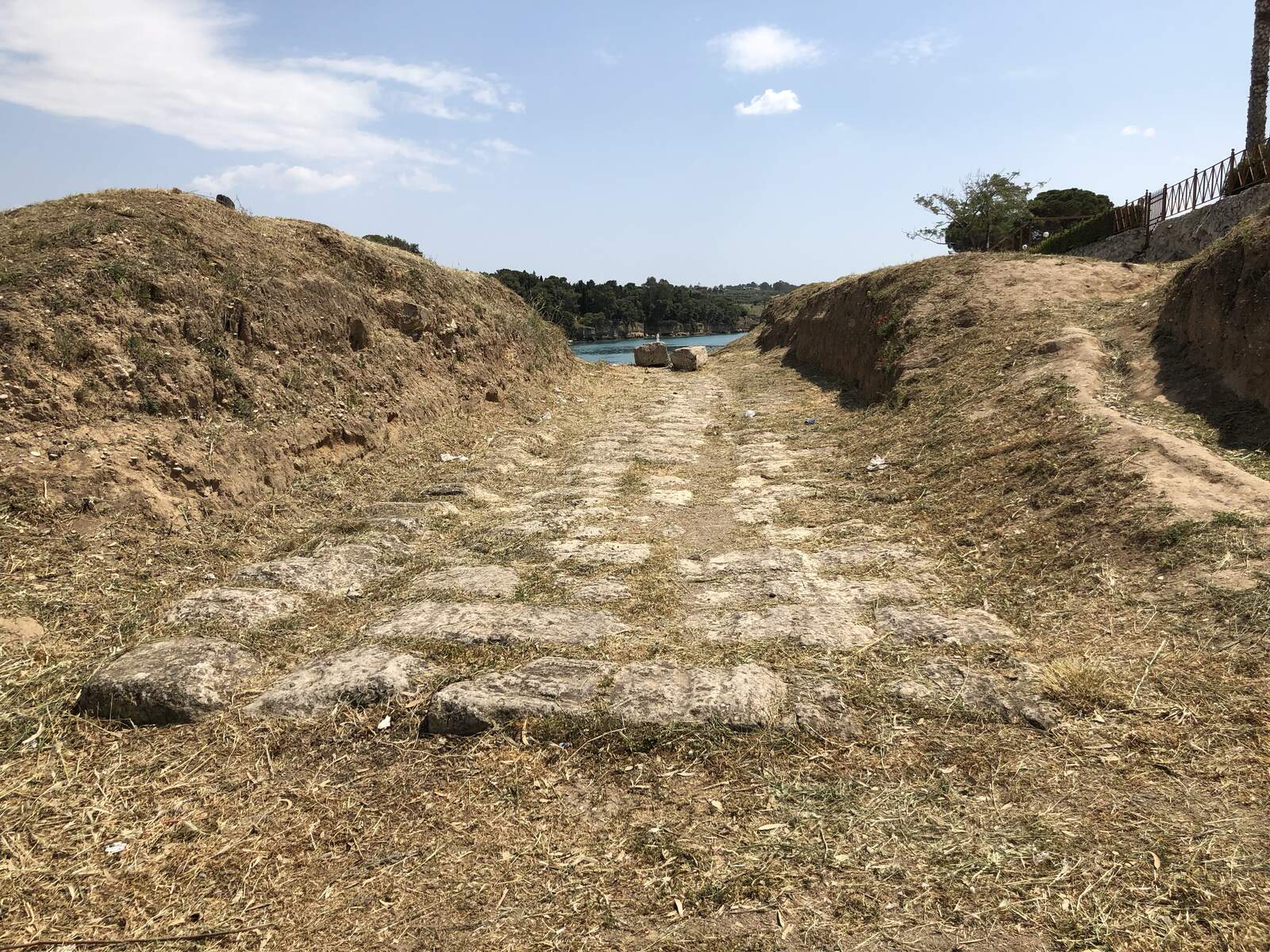 Ancient paved grooves of the Diolkos trackway near the Corinth Canal, Greece
